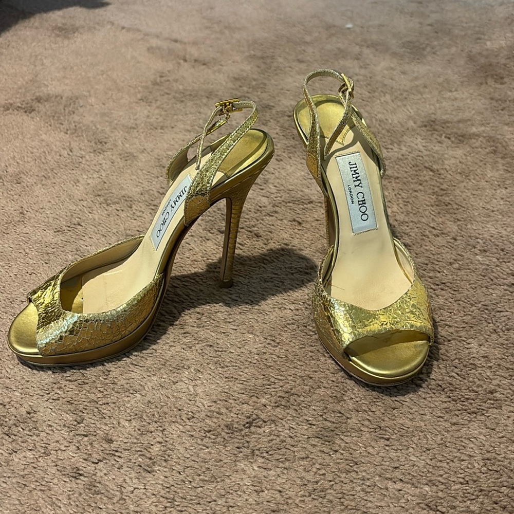 Jimmy Choo gold sandals. I wore a few times .